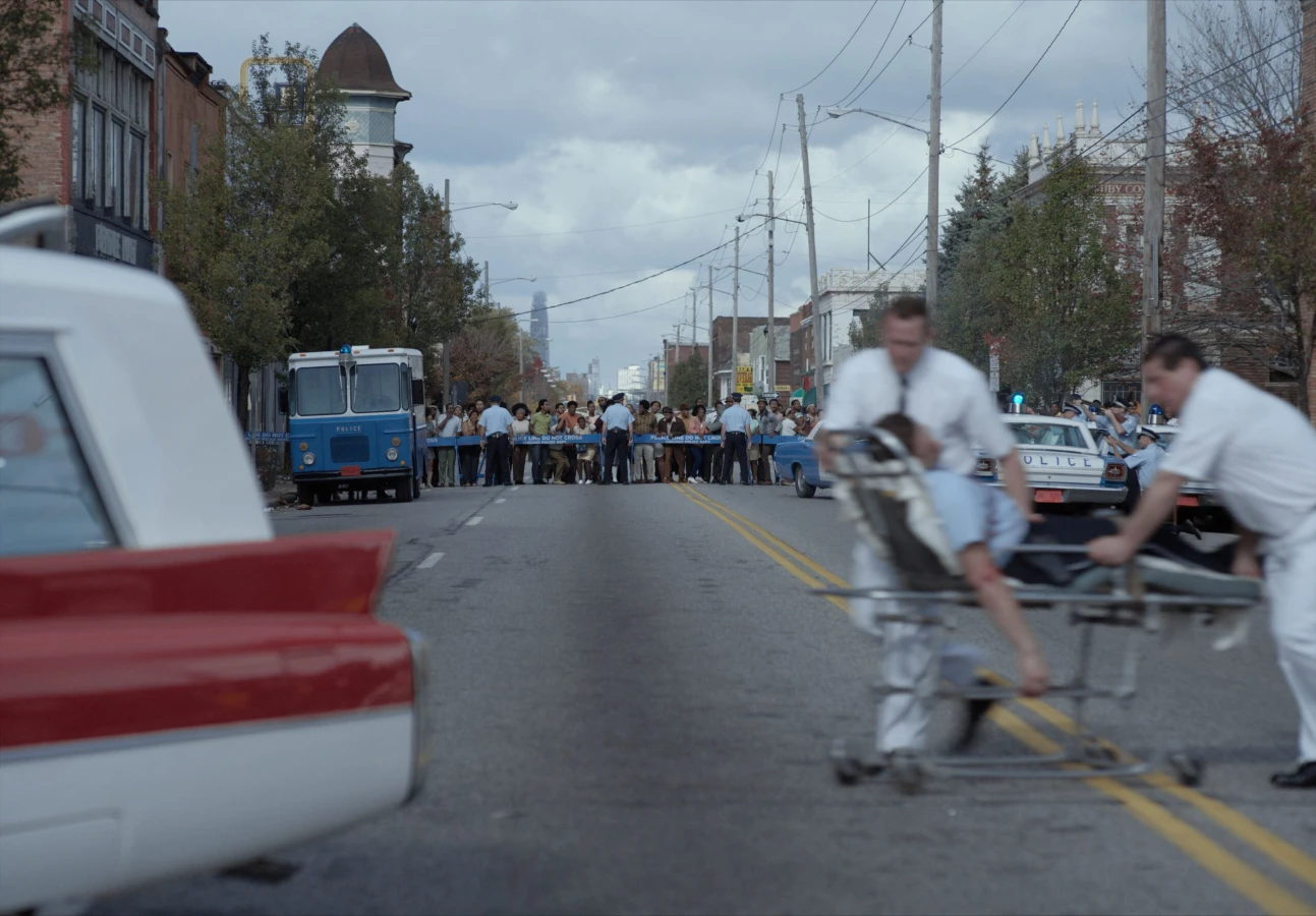 Judas and the Black Messiah men running with an injured person on a stretcher from Raynault vfx